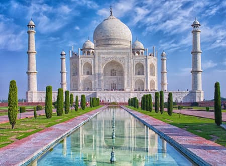 Taj Mahal at morning light with reflection in water in Agra, Uttar Pradesh, India