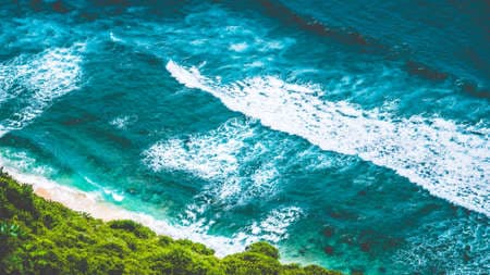 Aerial view of Nunggalan Beach near Uluwatu, Bali, Indonesia