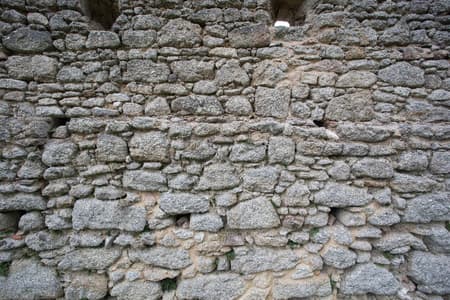 Real stone wall surface pattern gray color style design decorative uneven cracked